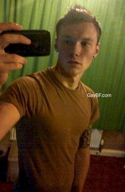 Handsome teen boy standing in the bathroom, having a fully erected cock with the foreskin pulled back